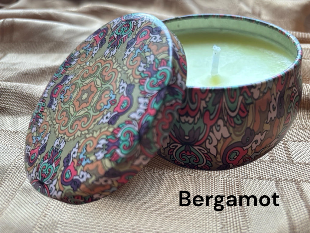 Bergamont scented mosaic candle encassed in a stunning vibrant tin. It blends striking visual artistry with a premium fragrance experience! 