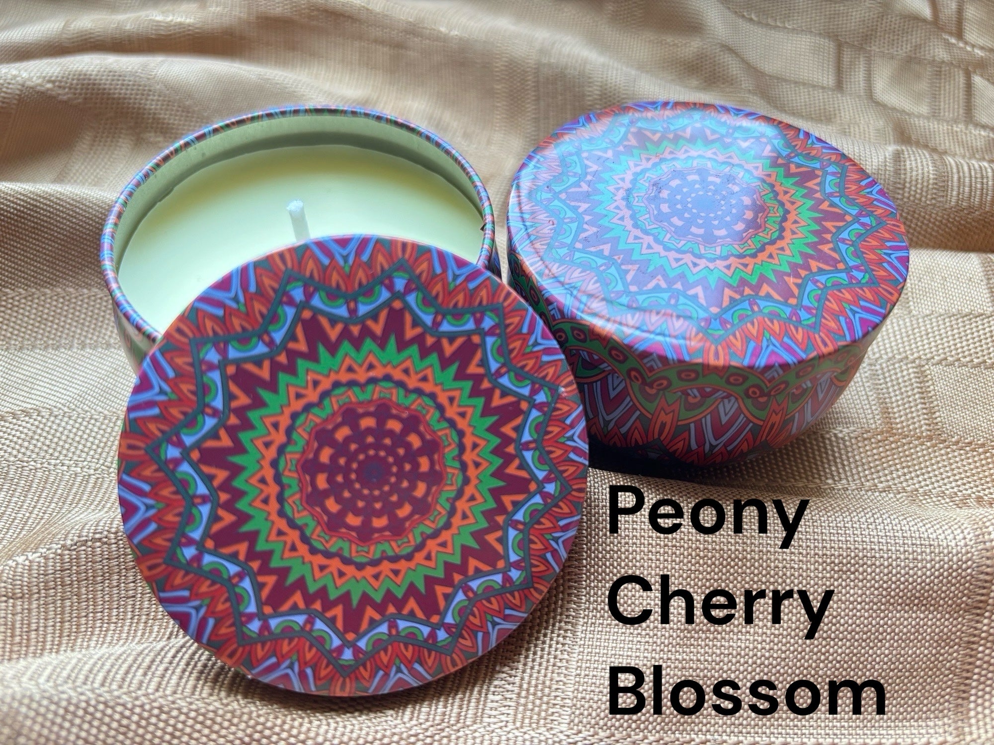 Cherry blossom scented mosaic candle encassed in a stunning vibrant tin. It blends striking visual artistry with a premium fragrance experience! 