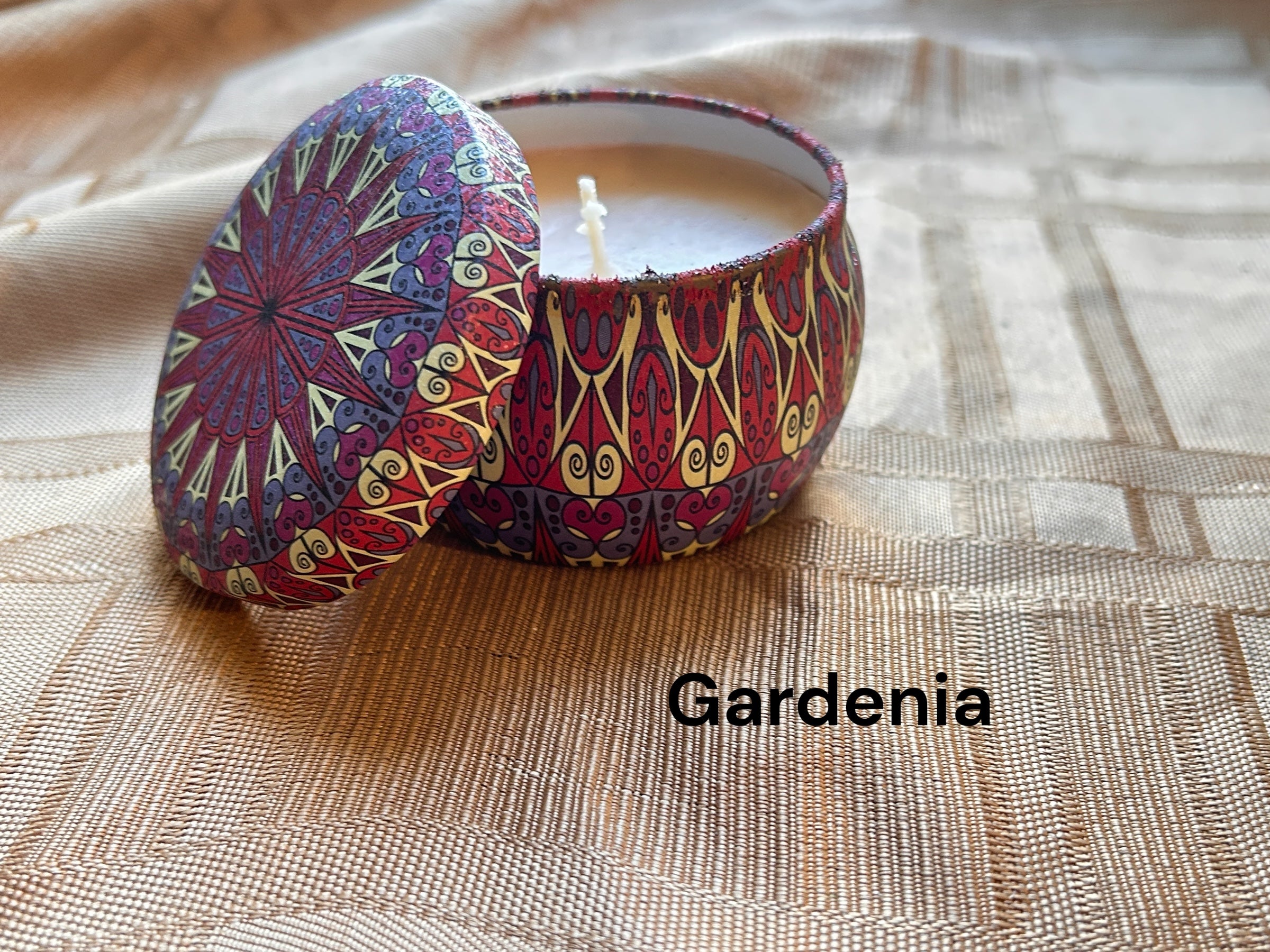 Gardenia scented mosaic candle encassed in a stunning vibrant tin. It blends striking visual artistry with a premium fragrance experience! 
