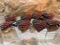 This Wrapables heart keychain features a puffy design adorned with red, white, and blue rhinestones forming an American flag pattern.It includes a gold-toned key ring, a lobster clasp for attachment to purses or handbags, and a dark blue tassel.The heart charm measures approximately 2.5 inches by 2.5 inches.The reverse side is made of a soft plush velvet material.