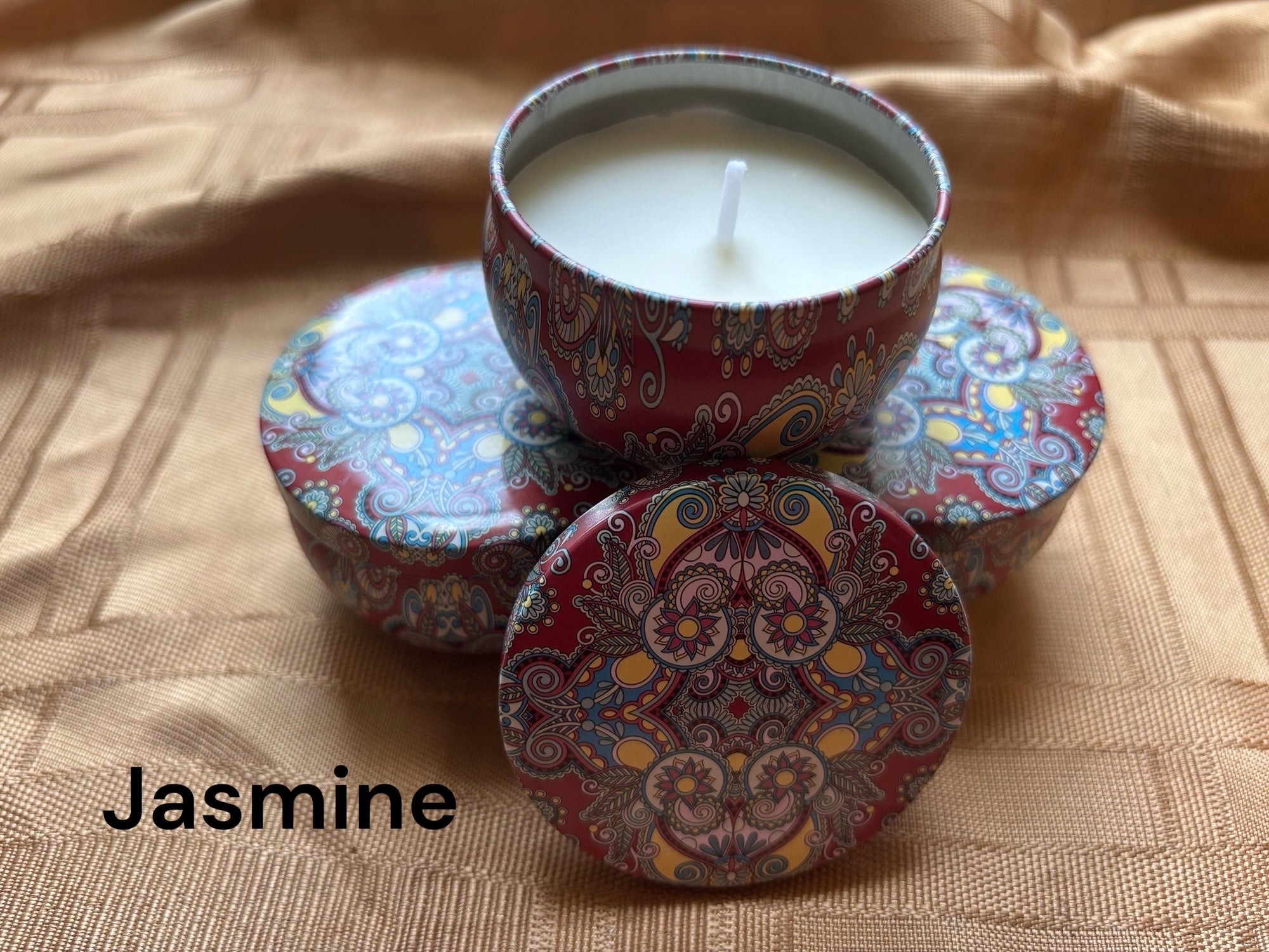 Jasmine scented mosaic candle encassed in a stunning vibrant tin. It blends striking visual artistry with a premium fragrance experience! 
