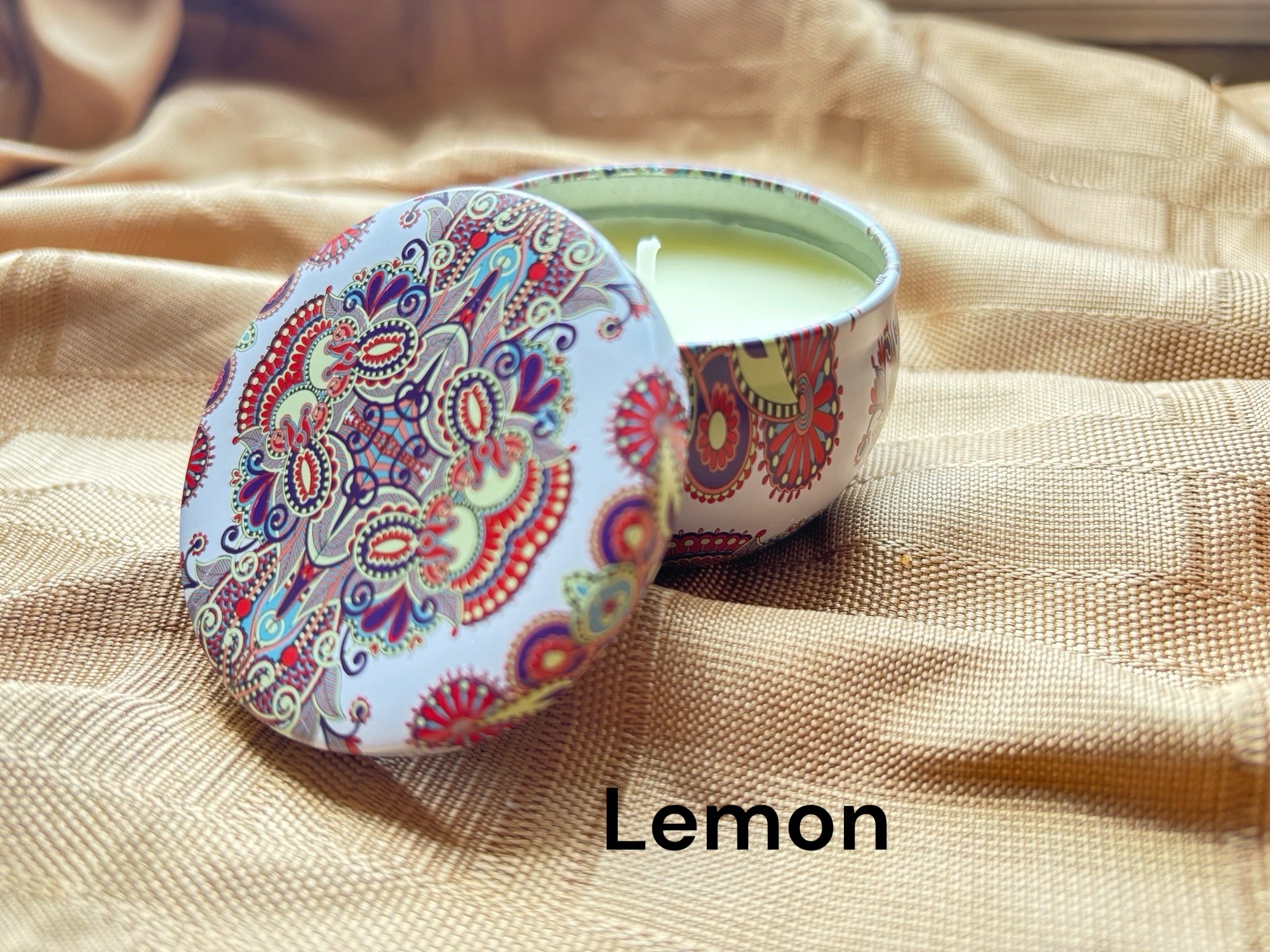 Lemon scented mosaic candle encassed in a stunning vibrant tin. It blends striking visual artistry with a premium fragrance experience! 