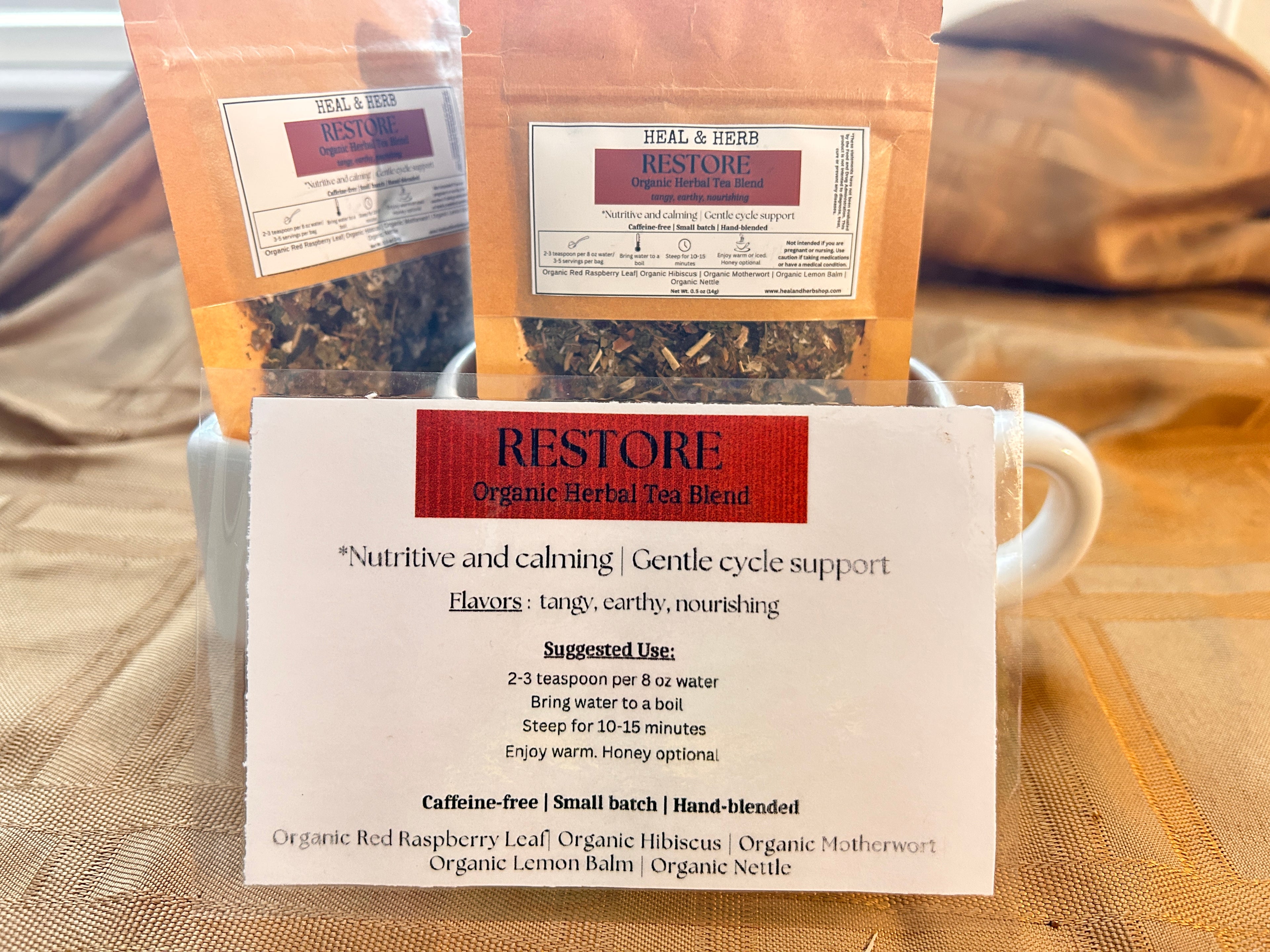 Our RESTORE Organic Herbal Tea blend is a calming and nourishing mix formulated to support women's health, ease PMS discomfort, and promote balance throughout the menstrual cycle. Perfect for grounding the body and mind during that time of the month.

Hibiscus and lemon balm bring a bright, floral flavor and gentle relaxation, while motherwort and raspberry leaf have been traditionally used to support the uterus. Nettle adds a rich source of minerals, helping to replenish and restore.

Caffeine-free | Small