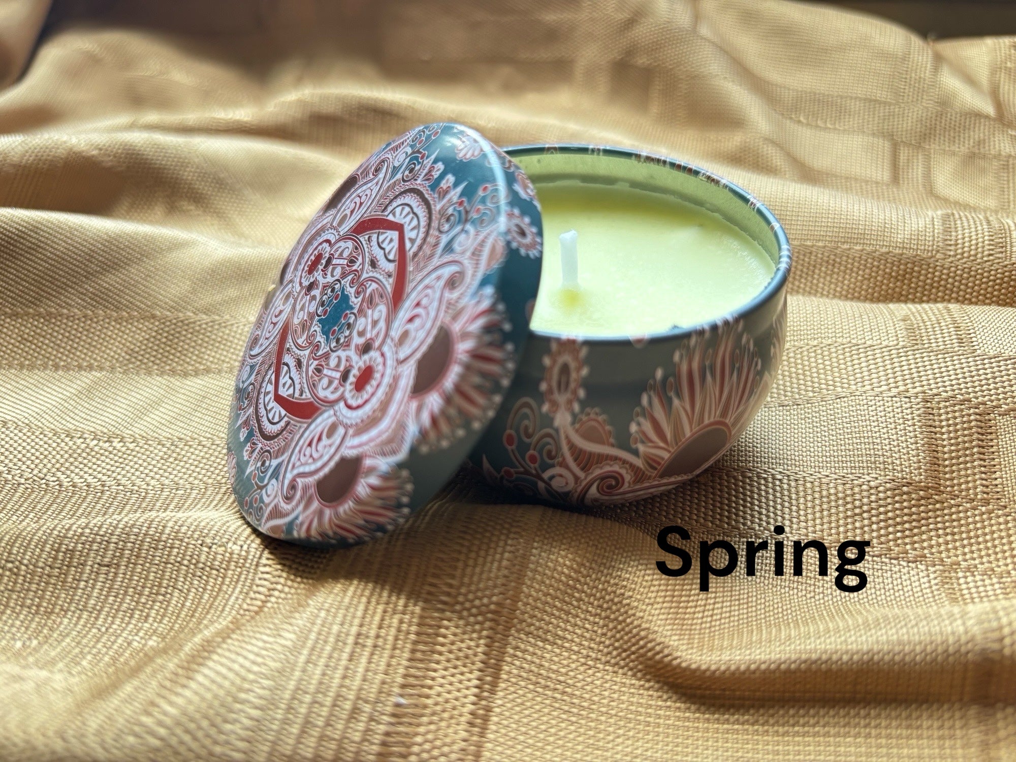 Spring  scented mosaic candle encassed in a stunning vibrant tin. It blends striking visual artistry with a premium fragrance experience! 